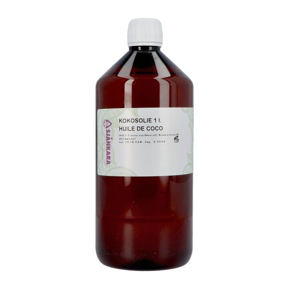 Bouteille marron avec bouchon blanc. Étiquette avec texte: Kokosolie 1 l, Huile de Coco. Marque Sjankara.