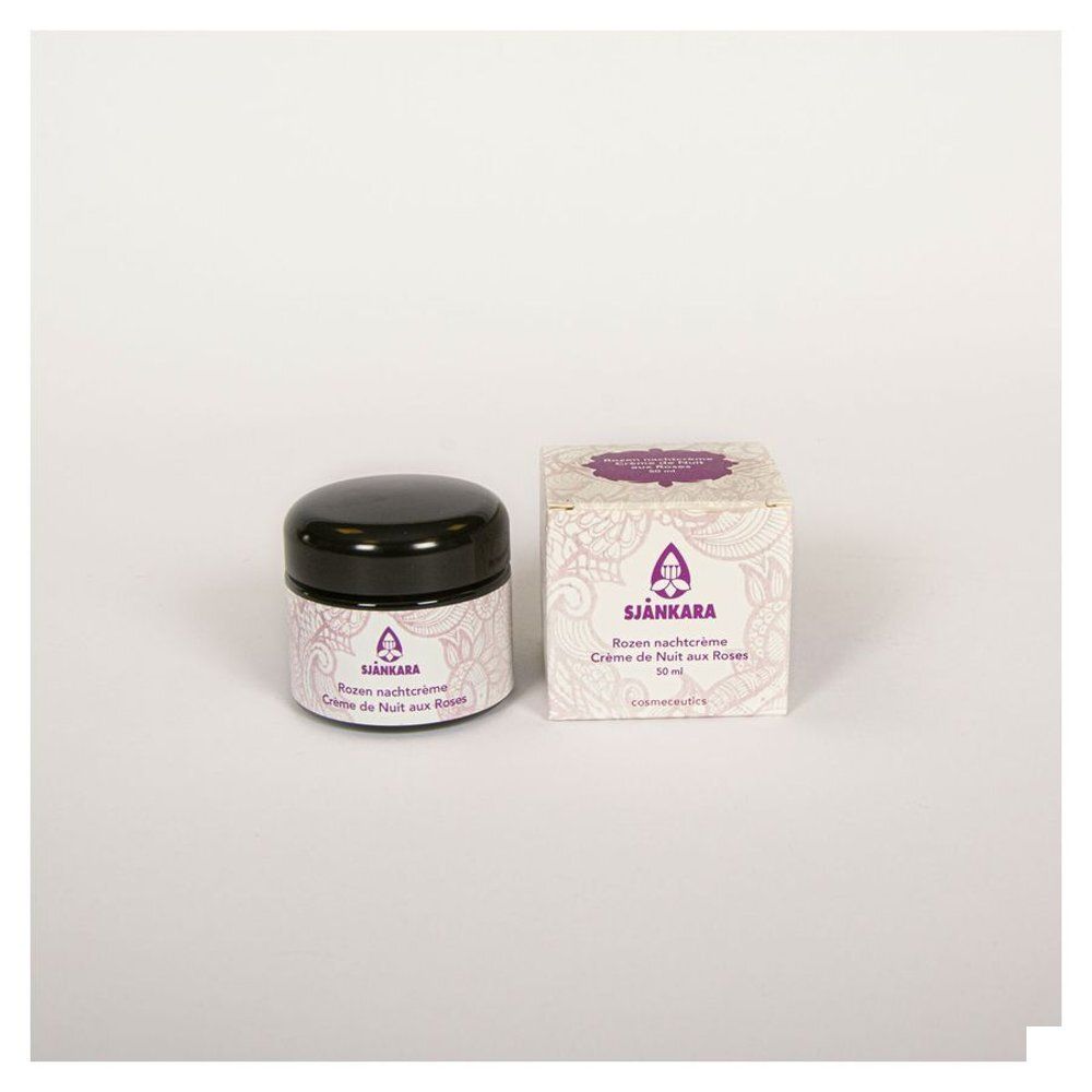 Pot et boîte de crème. Inscription : Sjankara, Crème de Nuit aux Roses. Couvercle noir, emballage blanc.