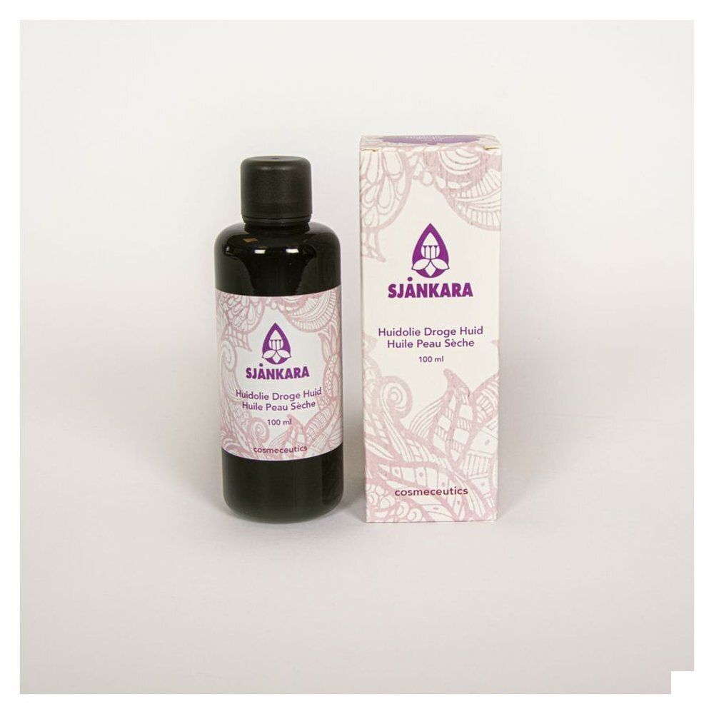 Fles en verpakking met SJÄNKARA. Opschrift: Huidolie Droge Huid Huile Peau Seche. Cosmetisch product.