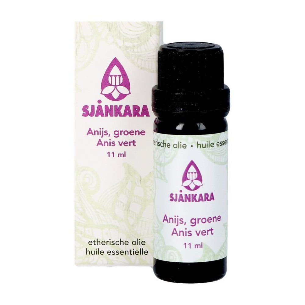 Fles en verpakking van essentiële olie. Opschrift: Sjnkara, Anis vert, 11 ml. Paars logo en tekst.