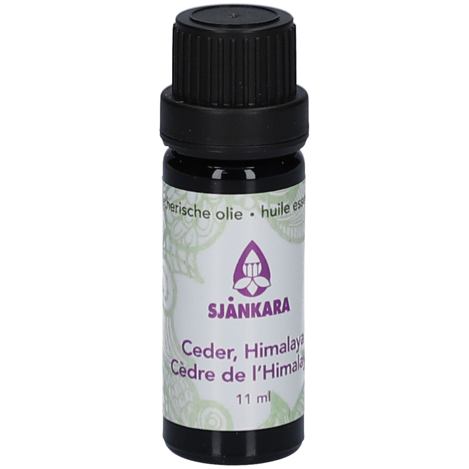 Flacon en verre brun avec bouchon noir. Étiquette avec nom et logo du produit. 11 ml.