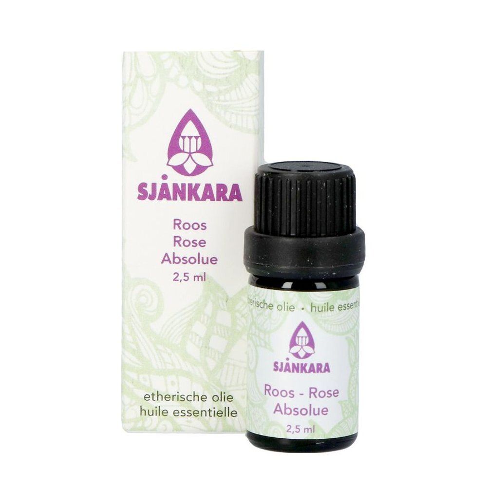 Flacon en verre brun et boîte. Sur le flacon: Roos-Rose Absolue, 2,5 ml. Sur la boîte: Logo, Roos-Rose Absolue, 2,5 ml.