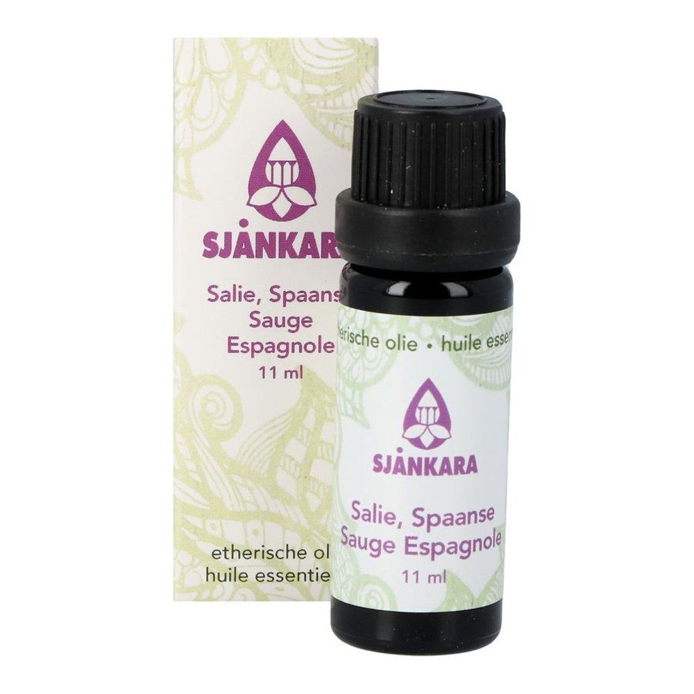 Bruine glazen fles en doos. Opdruk: Sjnkara, Salie, Sauge Espagnole, 11 ml. Bloemmotief.