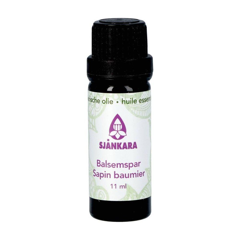 Bruine glazen fles met zwarte dop. Opschrift: SJANKARA, Balsamspar, Sapin baumier, 11 ml. Met logo.