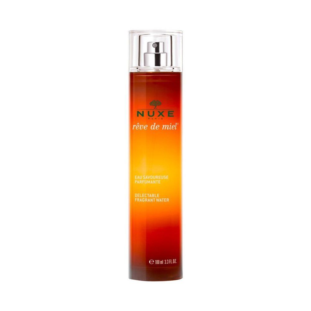 Nuxe Rêve de Miel Eau Savoureuse Parfumante fles met spraykop. Bruin en geel kleurverloop design.