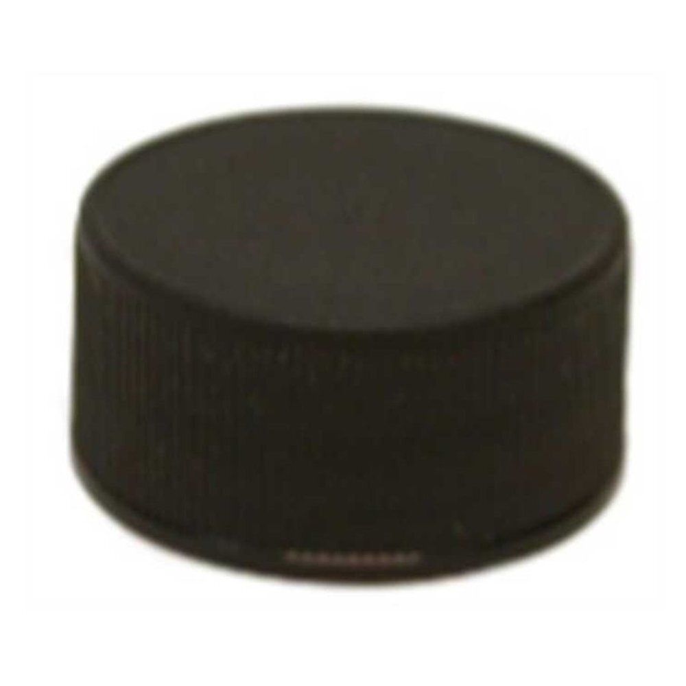 Couvercle noir, surface striée. Forme cylindrique.