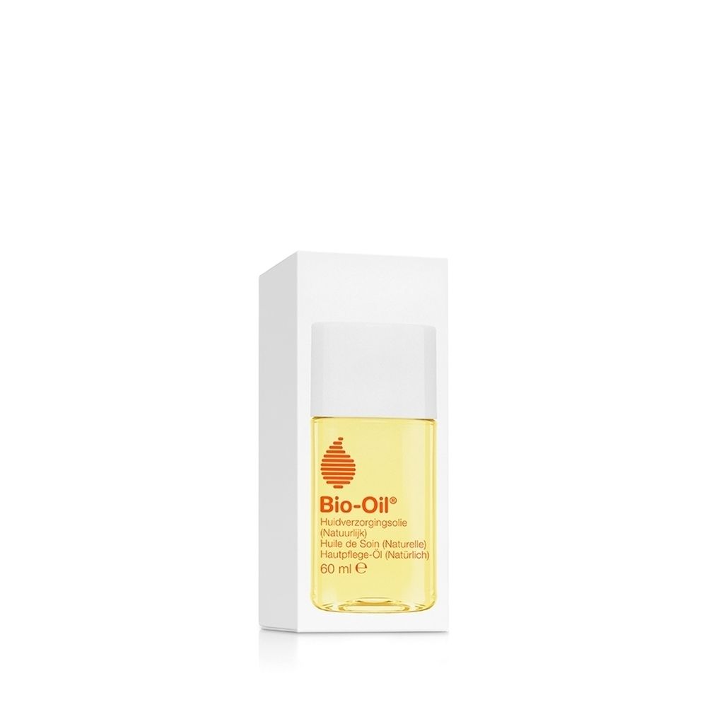 Flacon Bio-Oil avec bouchon blanc, rempli d'huile jaune. Logo orange-rouge et informations produit sur l'étiquette.