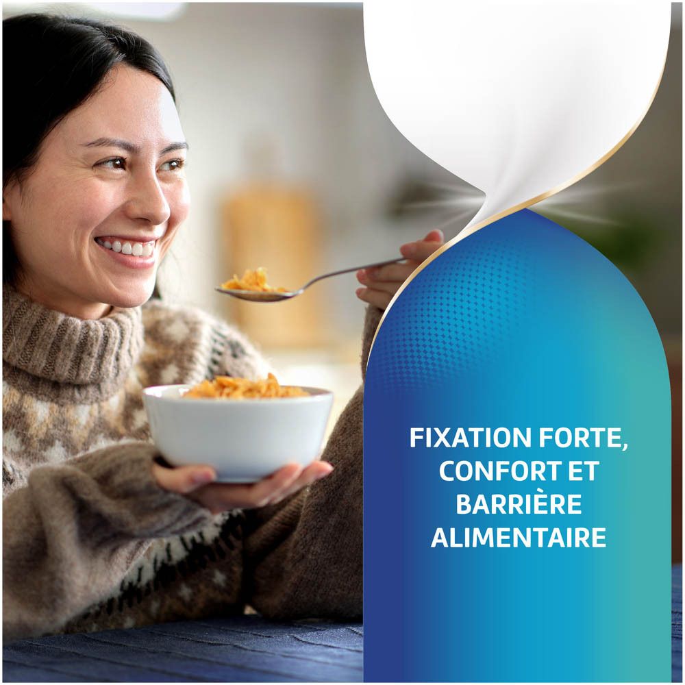 Femme mange des céréales. Texte: Fixation forte, confort et barrière alimentaire.