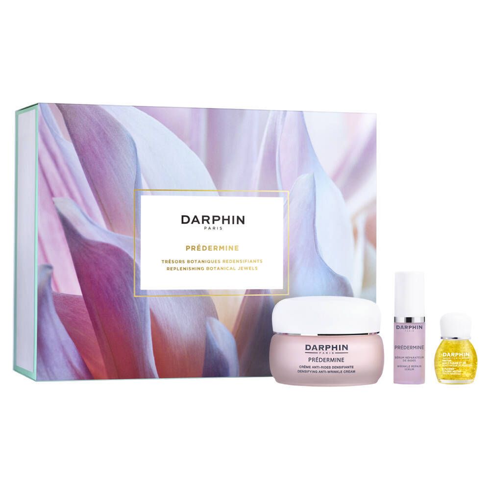 Geschenkset met crème, serum en olie. Verpakking met bloemenpatroon en productnaam.