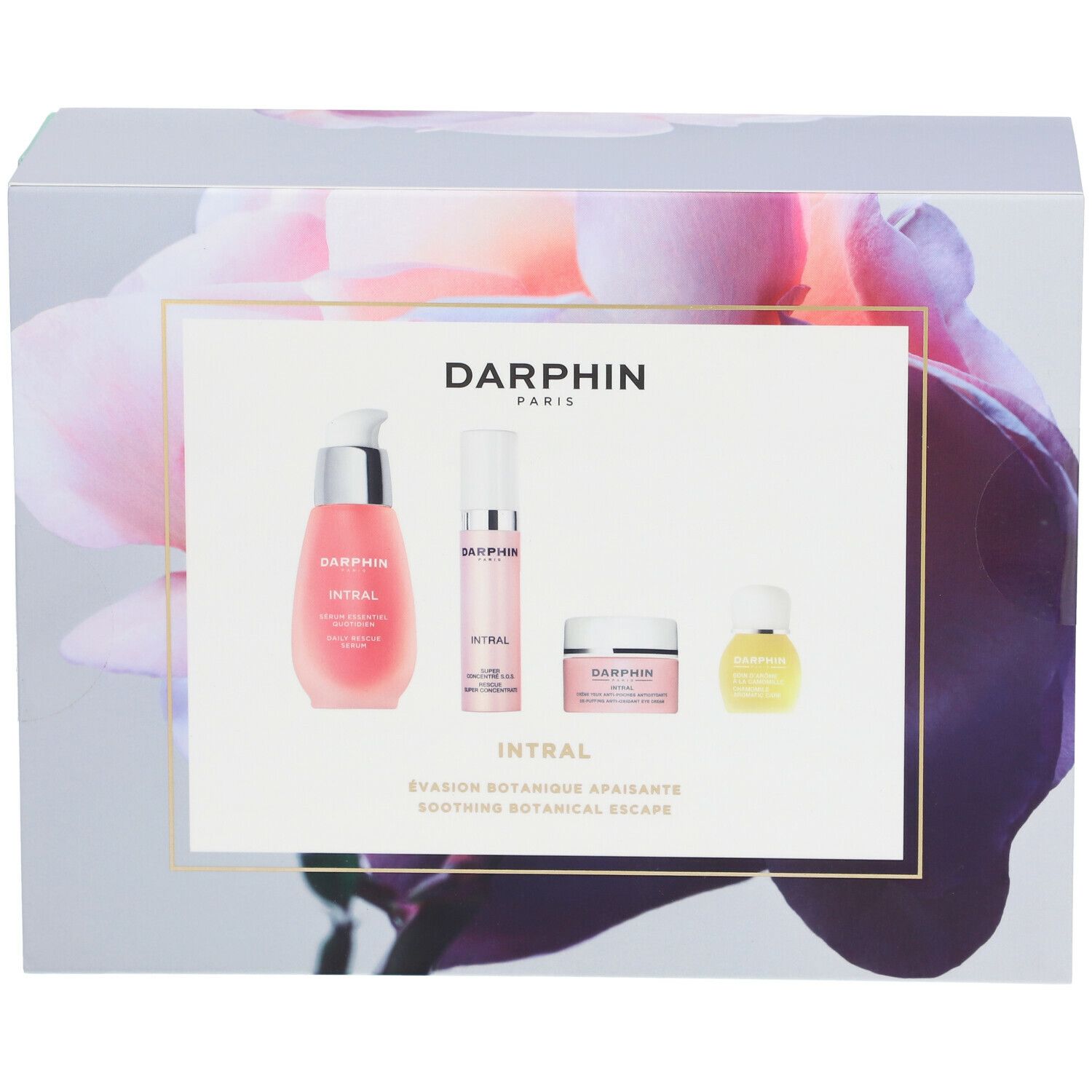 Cadeauset met vier producten. Roze vloeistoffen en crèmes in witte en transparante containers. Opschrift: DARPHIN INTRAL.