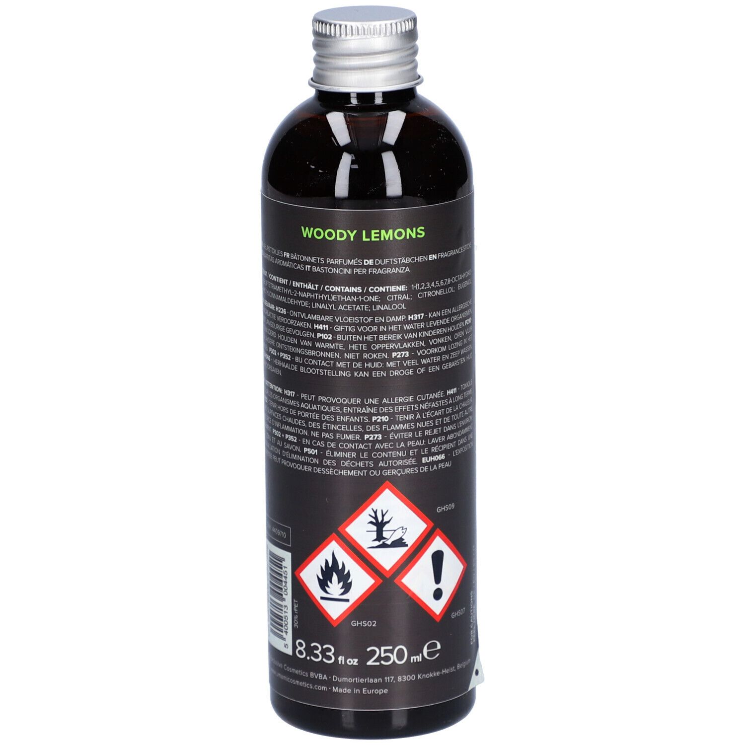 Flacon en verre brun avec bouchon argenté. Étiquette noire avec symboles d'avertissement, texte et quantité: 250 ml.