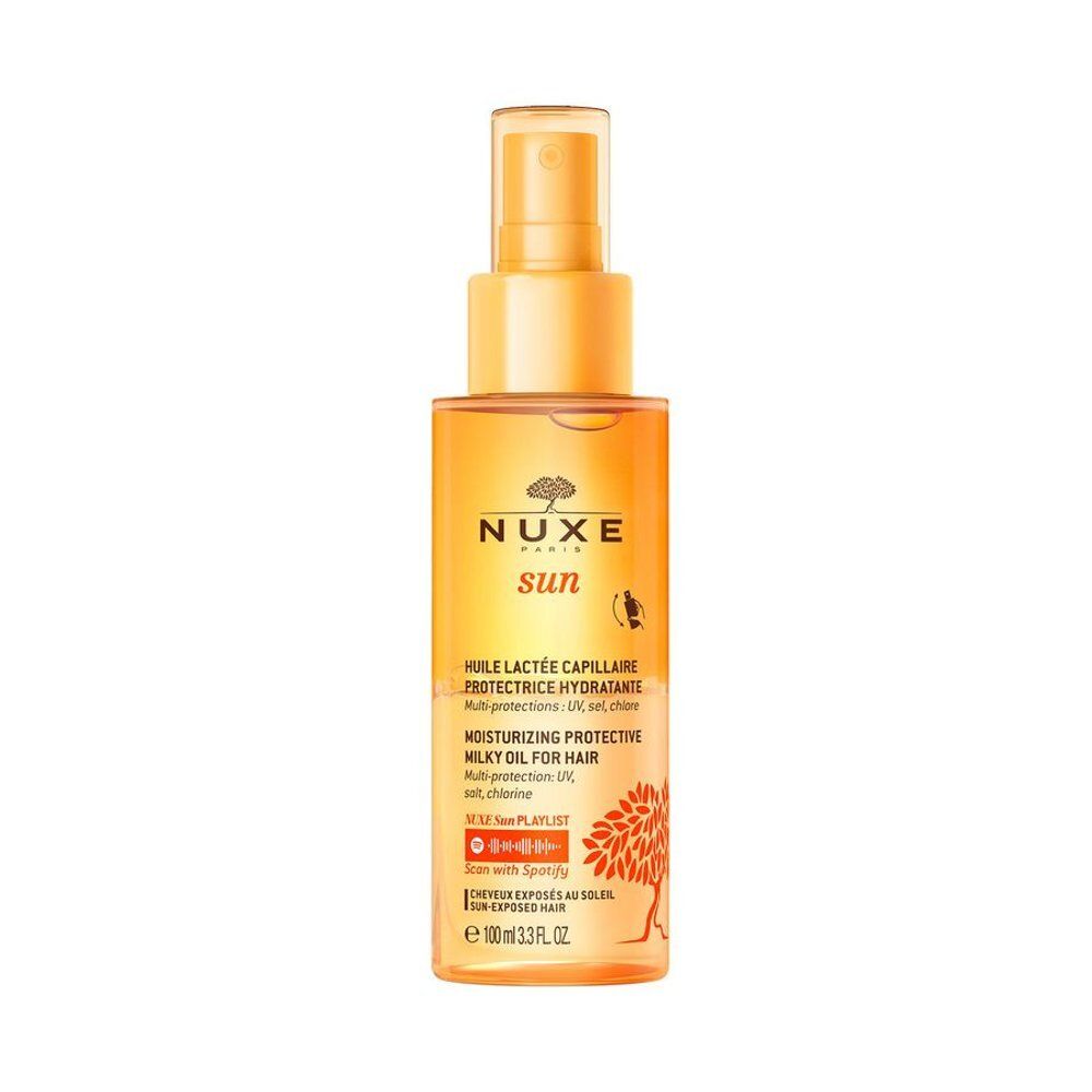 Nuxe Sun haarolie in doorzichtige fles met gouden spuitkop en etiket.