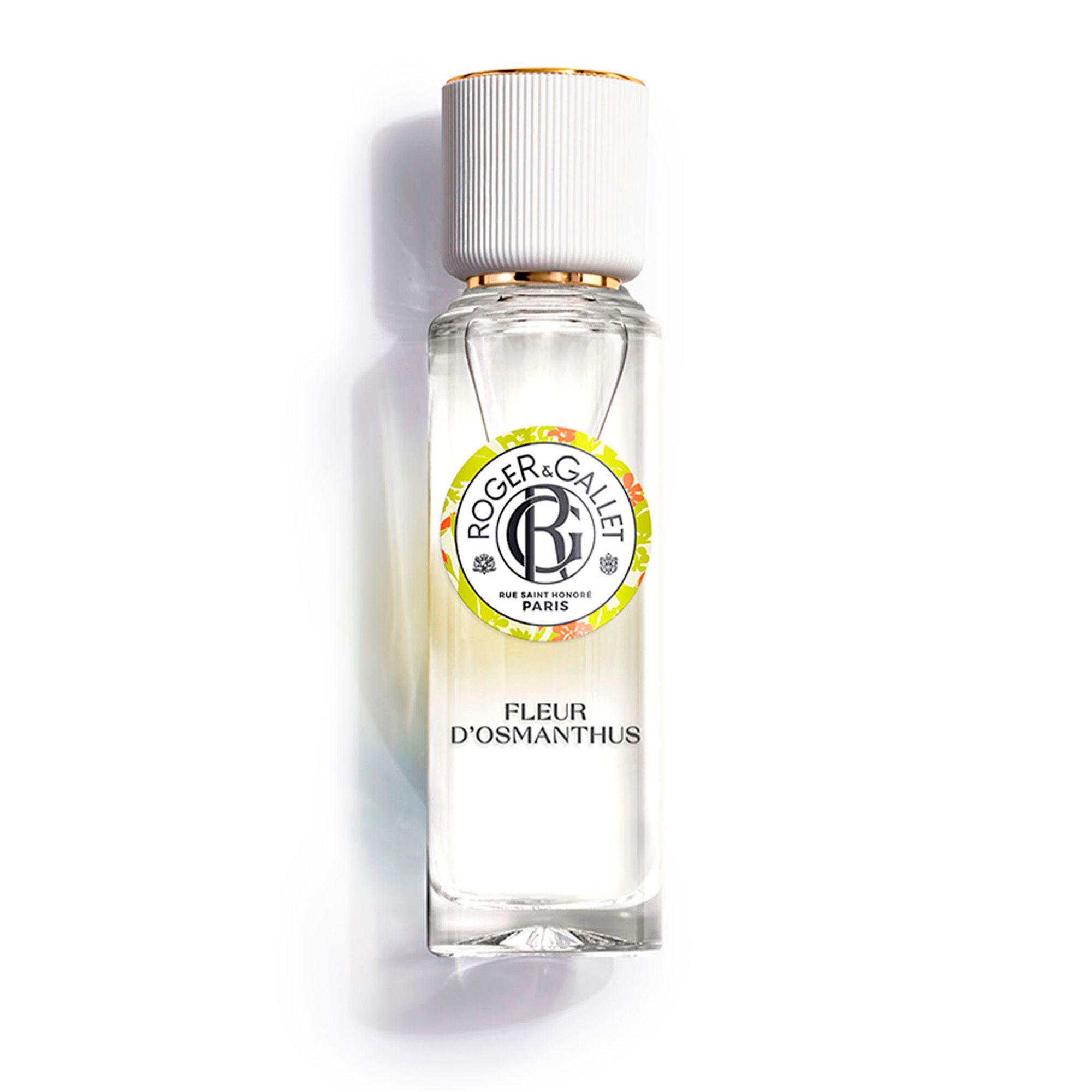 Fles met witte dop en gouden dop. Opschrift: FLEUR D'OSMANTHUS. Logo en tekst.
