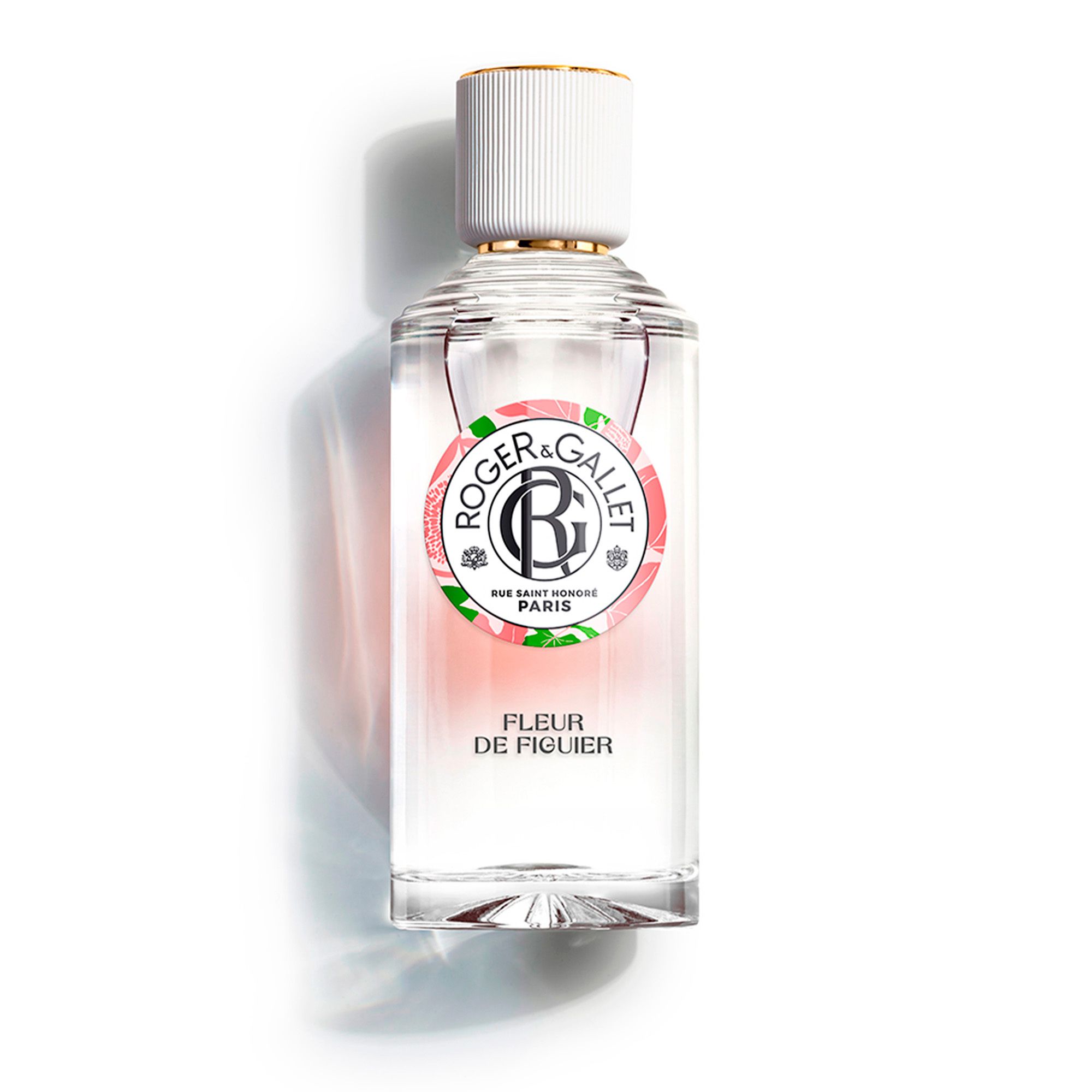 Flacon de Roger & Gallet Fleur de Figuier. Flacon transparent avec bouchon blanc et bague dorée. Étiquette avec logo.