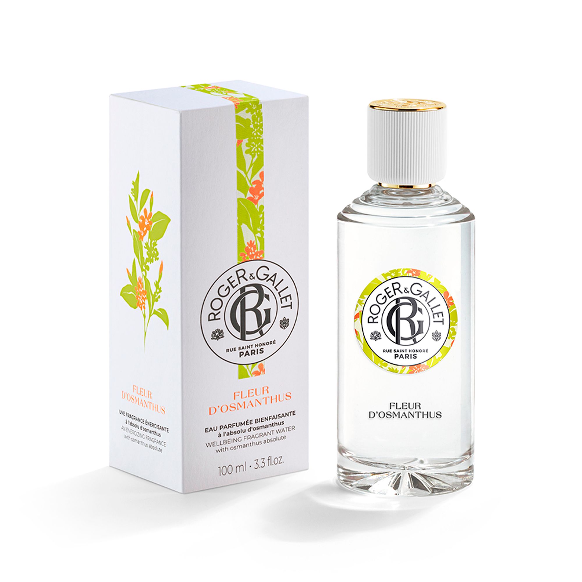 Emballage produit avec flacon et boîte. Flacon avec bouchon blanc, étiquette avec logo et nom du produit. Boîte avec motif floral.