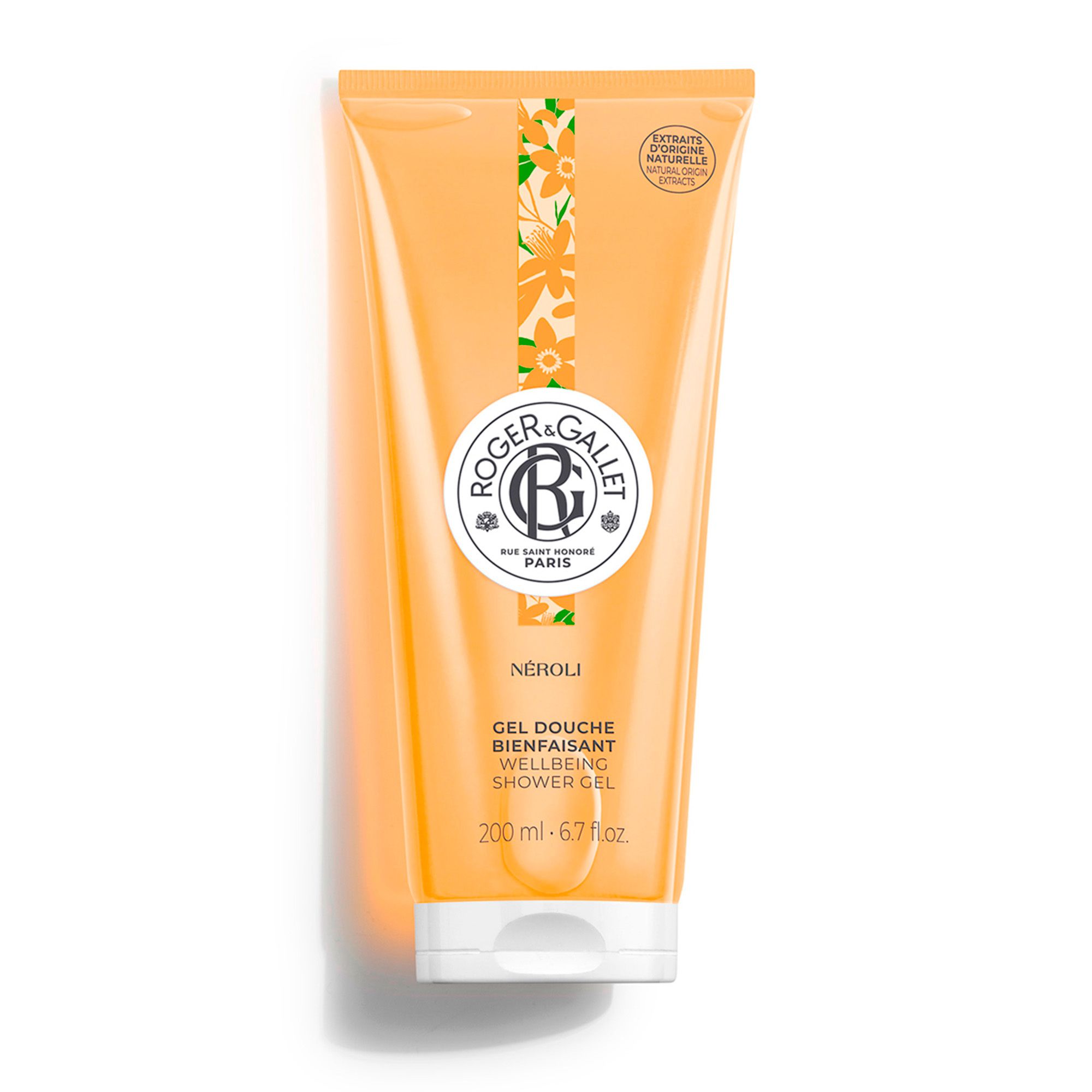 Tube de gel douche orange. Logo et texte. "NÉROLI" et "GEL DOUCHE BIENFAISANT WELLBEING SHOWER GEL" en dessous. Bouchon blanc.