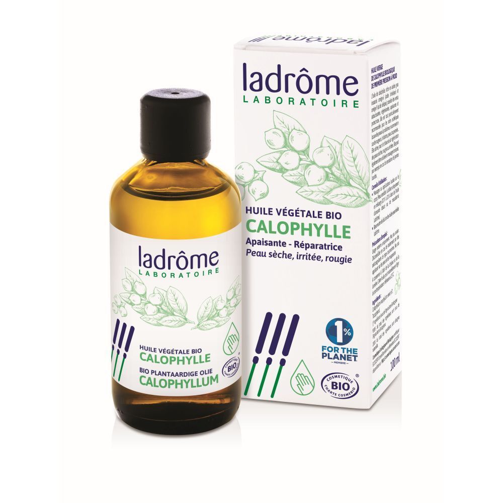 Flacon en verre brun avec bouchon noir et boîte. Inscription: Calophylle, Huile végétale bio.