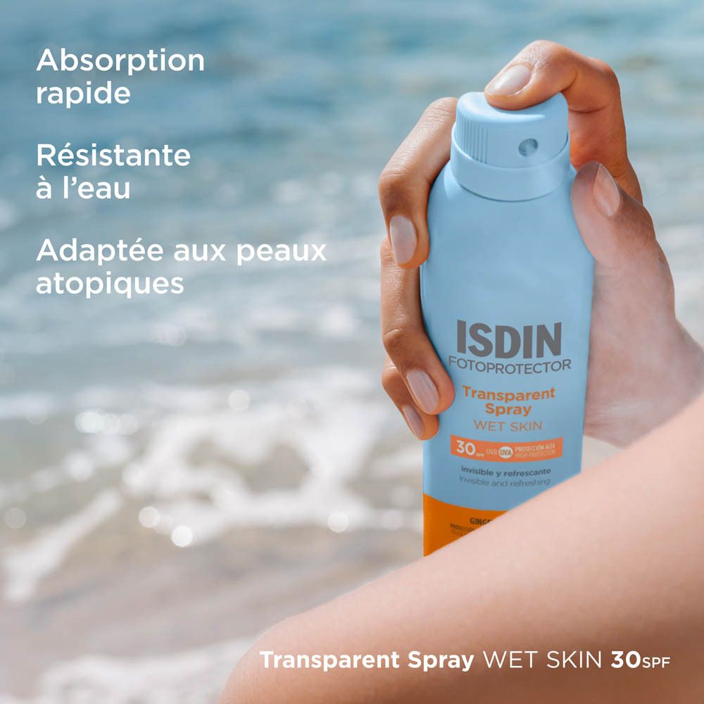 ISDIN Fotoprotector Spray. Flacon tenu à la main. Texte.