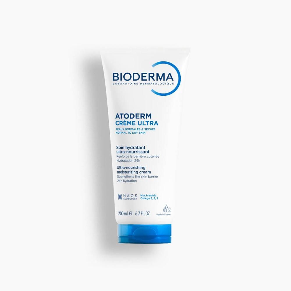 Tube blanc avec bouchon bleu. Inscriptions: BIODERMA, Atoderm Crème Ultra. Textes en français et anglais. 200 ml.