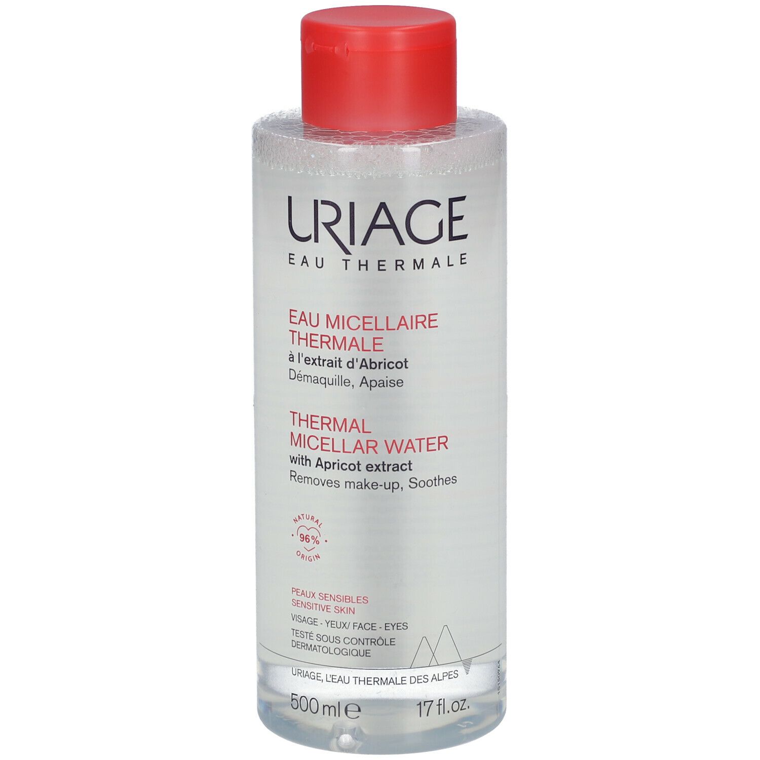 Flacon transparent, bouchon rouge. Inscription: Uriage Eau Micellaire Thermale. Extrait d'abricot. Pour peaux sensibles.