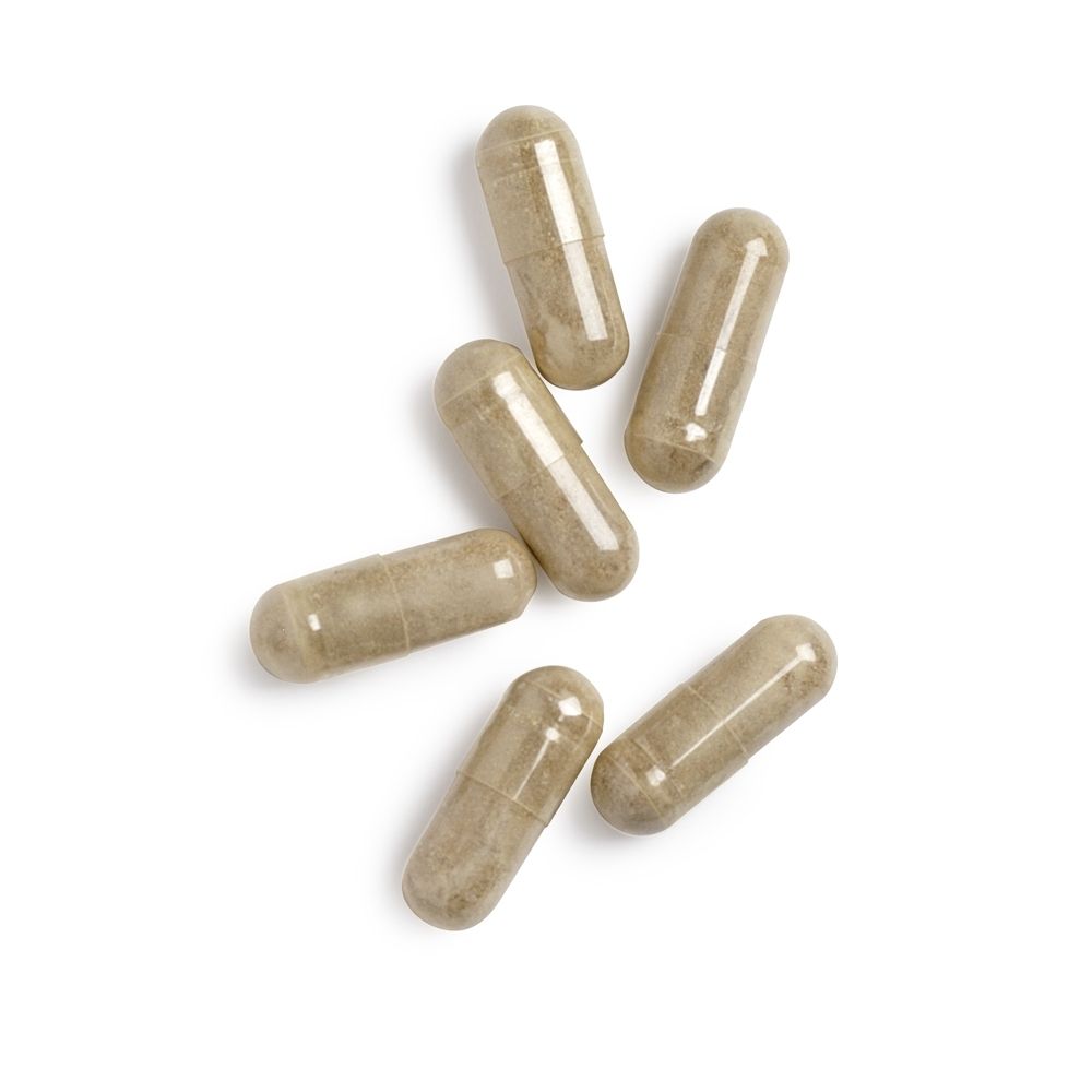 Zes ovale capsules op witte achtergrond. Lichtbruine kleur.