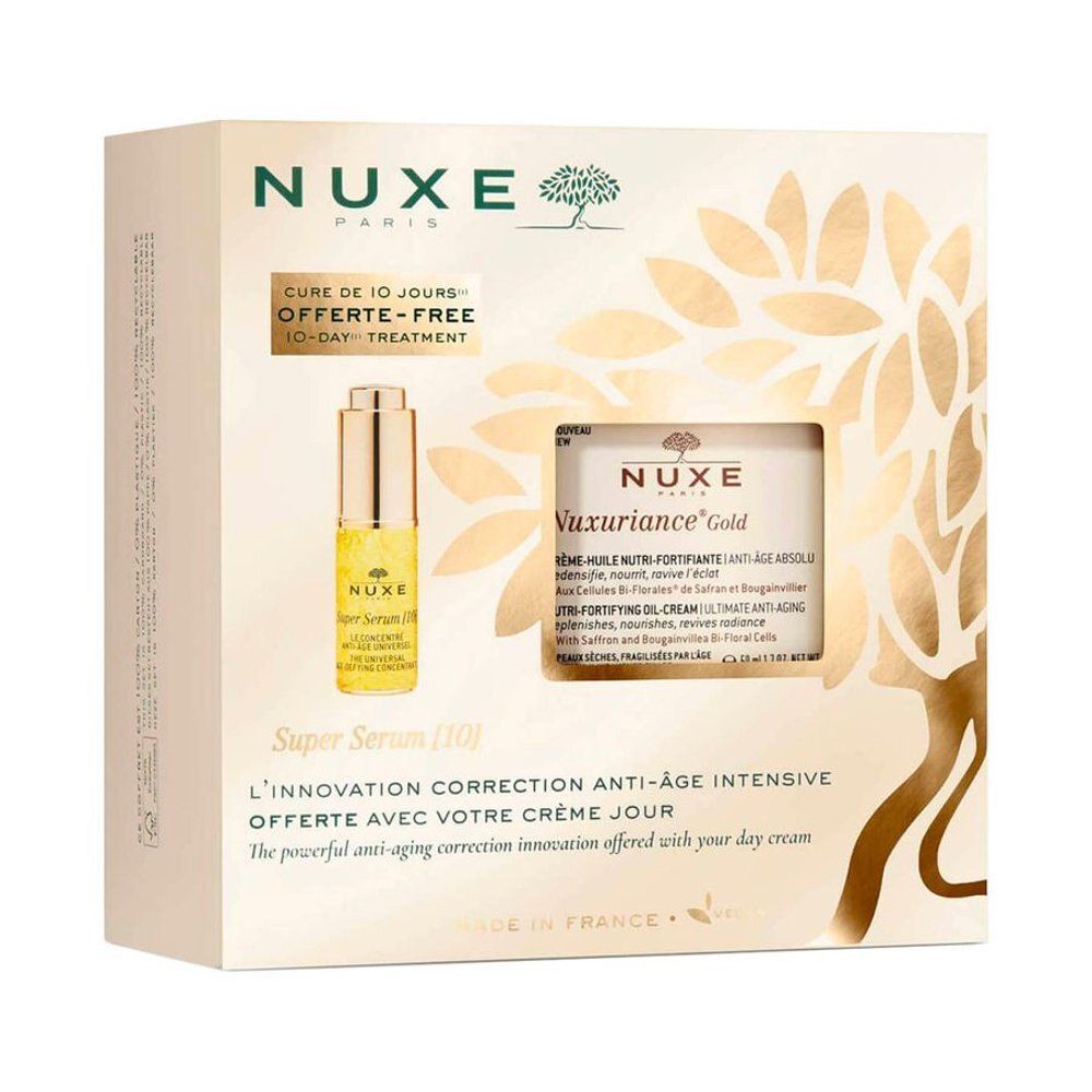 Geschenkset Nuxe Nuxuriance Gold. Beige verpakking met serum en crème. Tekst: Nuxe, Nuxuriance Gold, Super Serum [10].