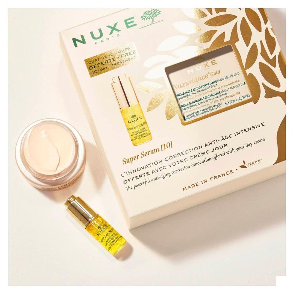 Open geschenkset Nuxe Nuxuriance Gold. Serum en crème zichtbaar. Opschriften: Nuxe, Nuxuriance Gold, Super Serum [10].