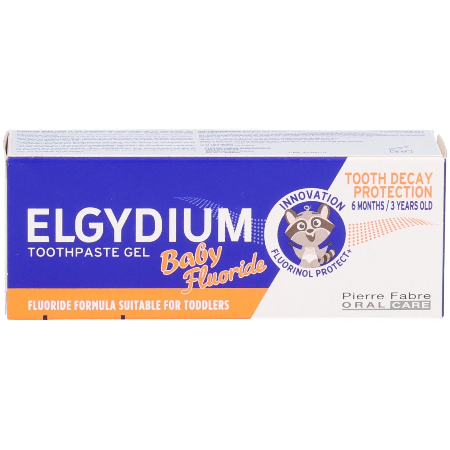 Boîte d'emballage Elgydium Baby Fluor gel dentifrice avec logo raton laveur et indications de protection contre les caries.