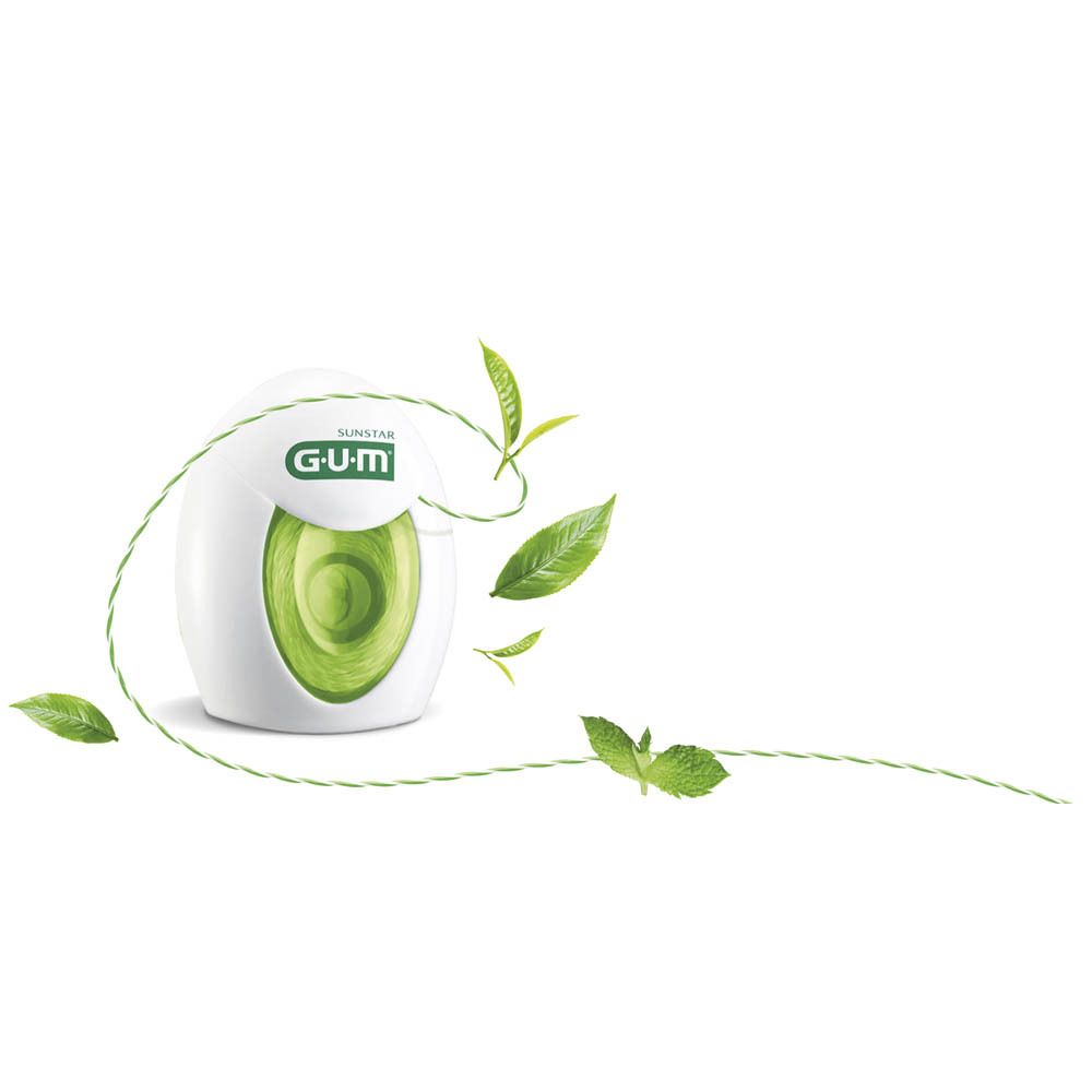 Wit en groene GUM Twisted Floss dispenser. Groene floss strengen en bladeren. Opschriften: SUNSTAR, GUM. Minty Green Tea.