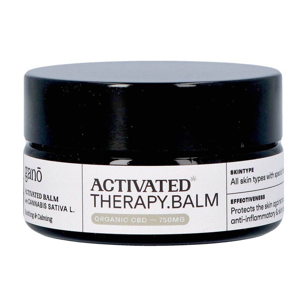 Donkere pot met zwarte deksel. Opschrift: Ganō, Activated Therapy Balm, CBD. Tekst: All skin types, 750mg.