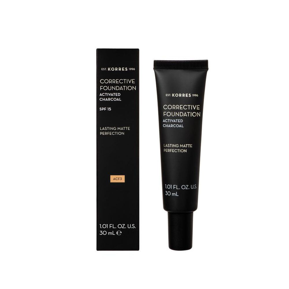 Zwarte tube en doos met opschrift "CORRECTIVE FOUNDATION ACTIVATED CHARCOAL". Bevat 30 ml.