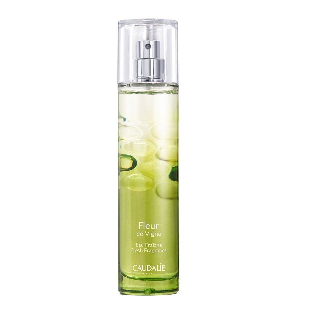 Fles Caudalie Fleur de Vigne Eau Fraiche, transparante spraypomp, groene vloeistof.