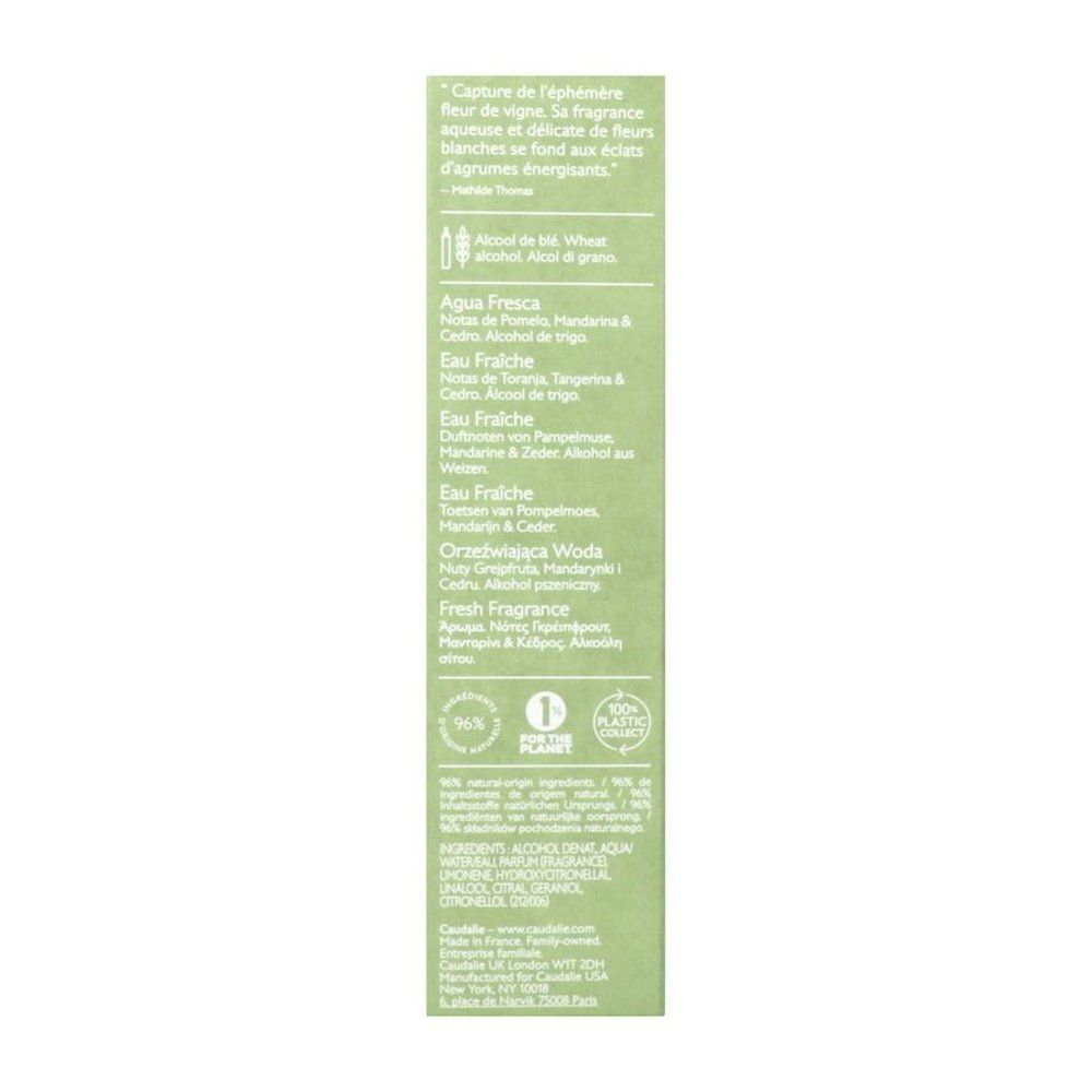 Huile Corps Tonic Clarins dans un flacon en verre avec bouchon blanc. Liquide jaune visible.
