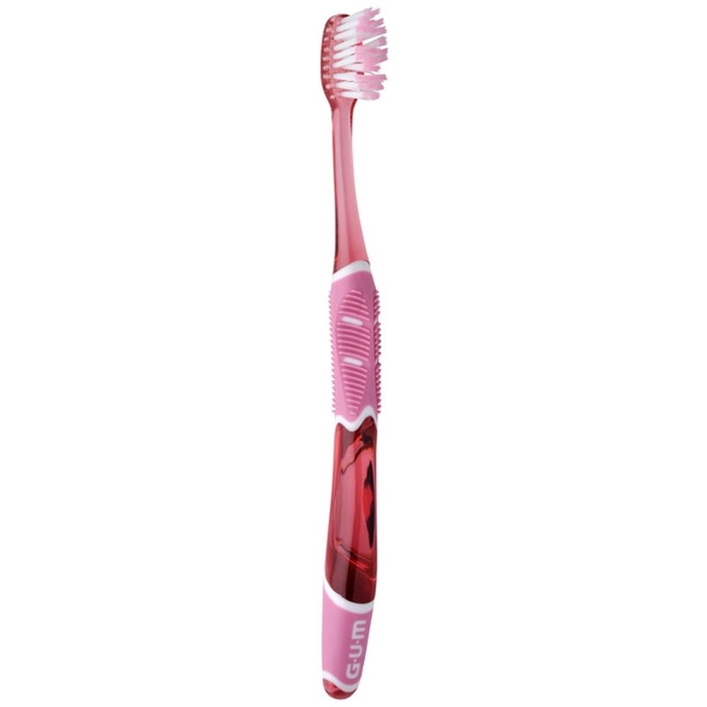 Brosse à dents rose-rouge GUM® PRO SENSITIVE. Manche transparent, soies roses. Nom et marque visibles.