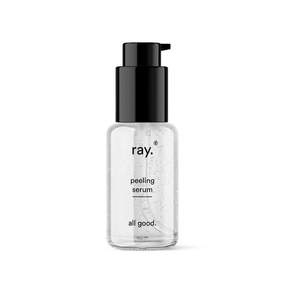 Transparante fles met zwarte pomp. Op de fles staat "ray.", "peeling serum" en "all good."