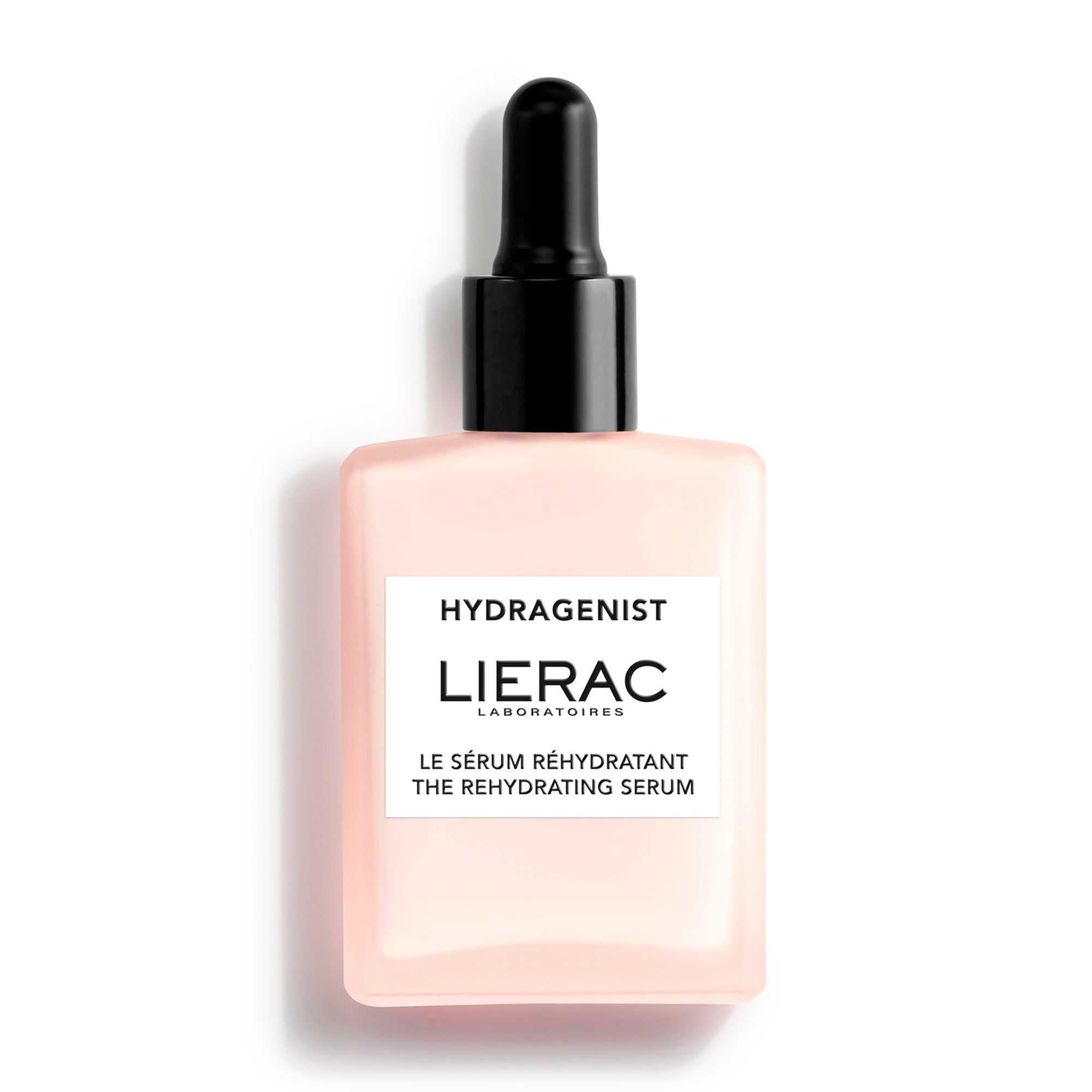 Roze serumfles met zwarte dop en pipet. Opschrift: HYDRAGENIST, LIERAC. Tekst: LE SÉRUM RÉHYDRATANT THE REHYDRATING SERUM.