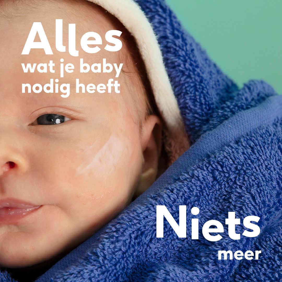 Baby met blauwe handdoek. Crème op wang. Tekst: Alles wat je baby nodig heeft. Niets meer.