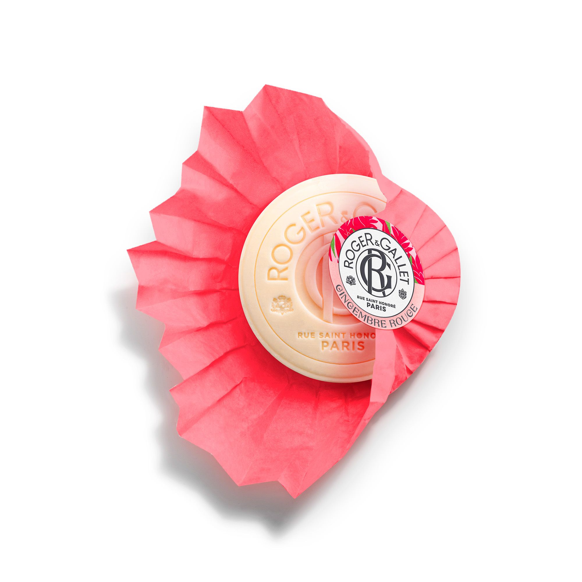 Savon rond rouge, avec ruban floral. Marque Roger & Gallet, slogan « Gingembre Rouge ».