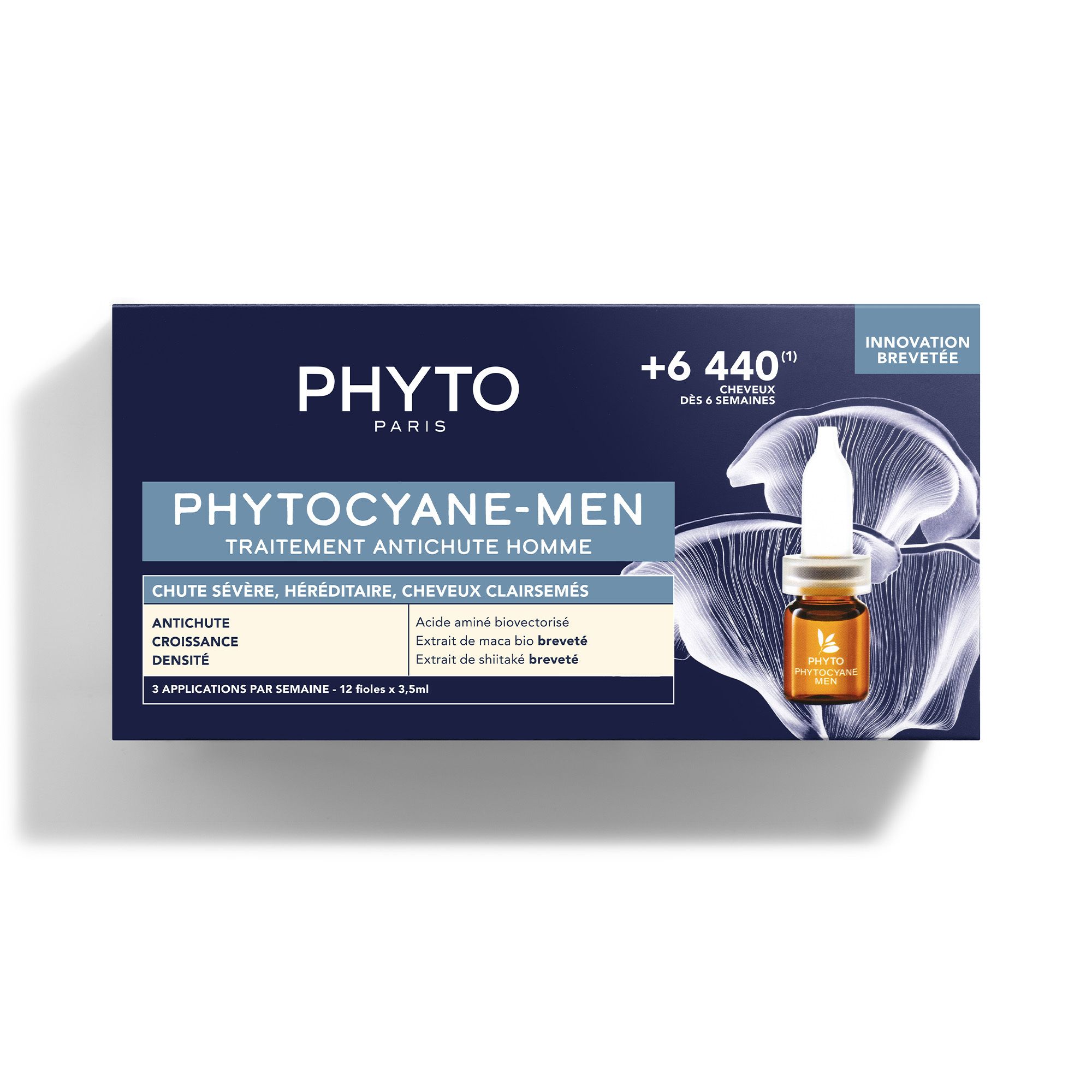 Donkerblauwe doos met ampul. Opschrift: PHYTO, PHYTO-CYANE-MEN, behandeling tegen haaruitval.