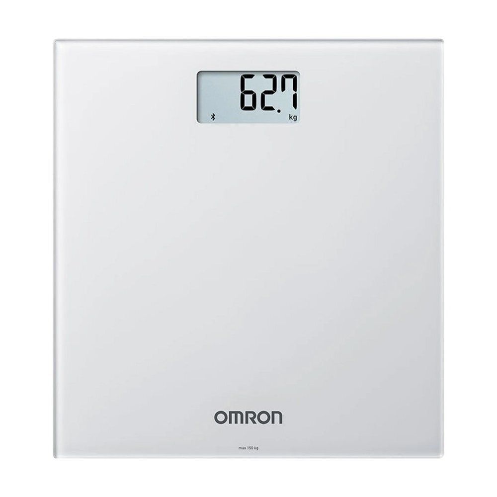 Balance numérique blanche. Affichage du poids. Logo OMRON. Symbole Bluetooth.