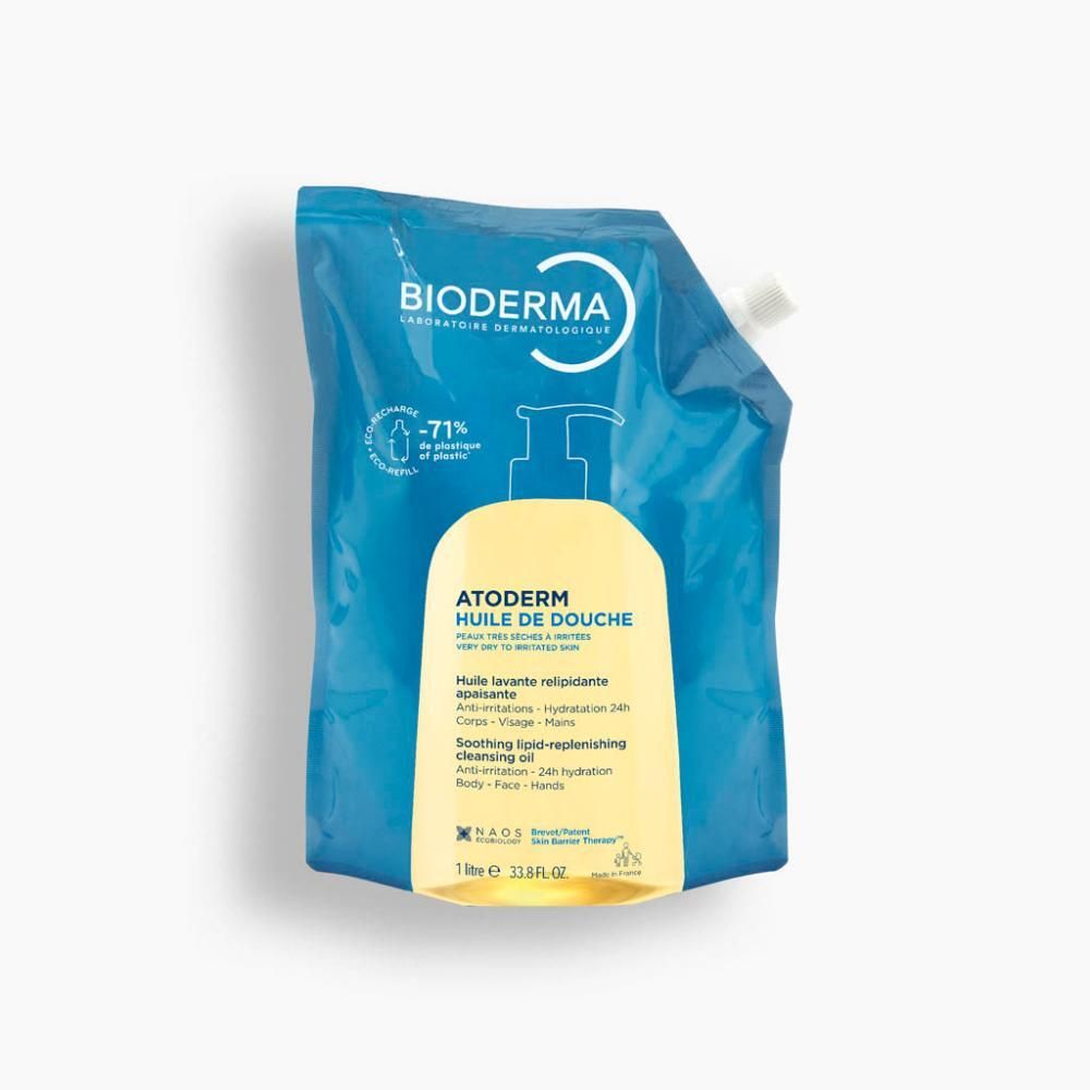 Recharge d'huile de douche. Emballage bleu transparent avec étiquette jaune. Contient le nom du produit et la marque. Avec pompe.