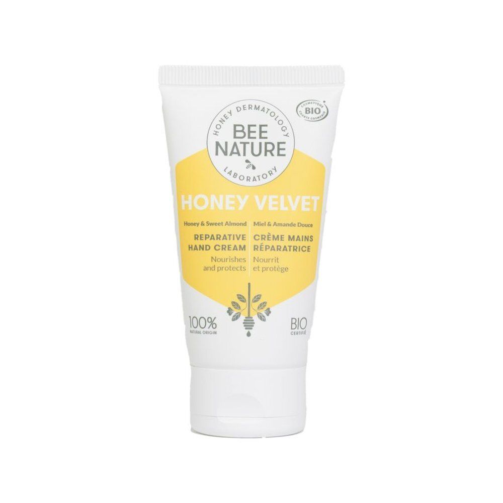 Tube blanche avec étiquette jaune. Inscription: HONEY VELVET, CRÈME MAINS RÉPARATRICE. Logo: BEE NATURE. Certification bio.
