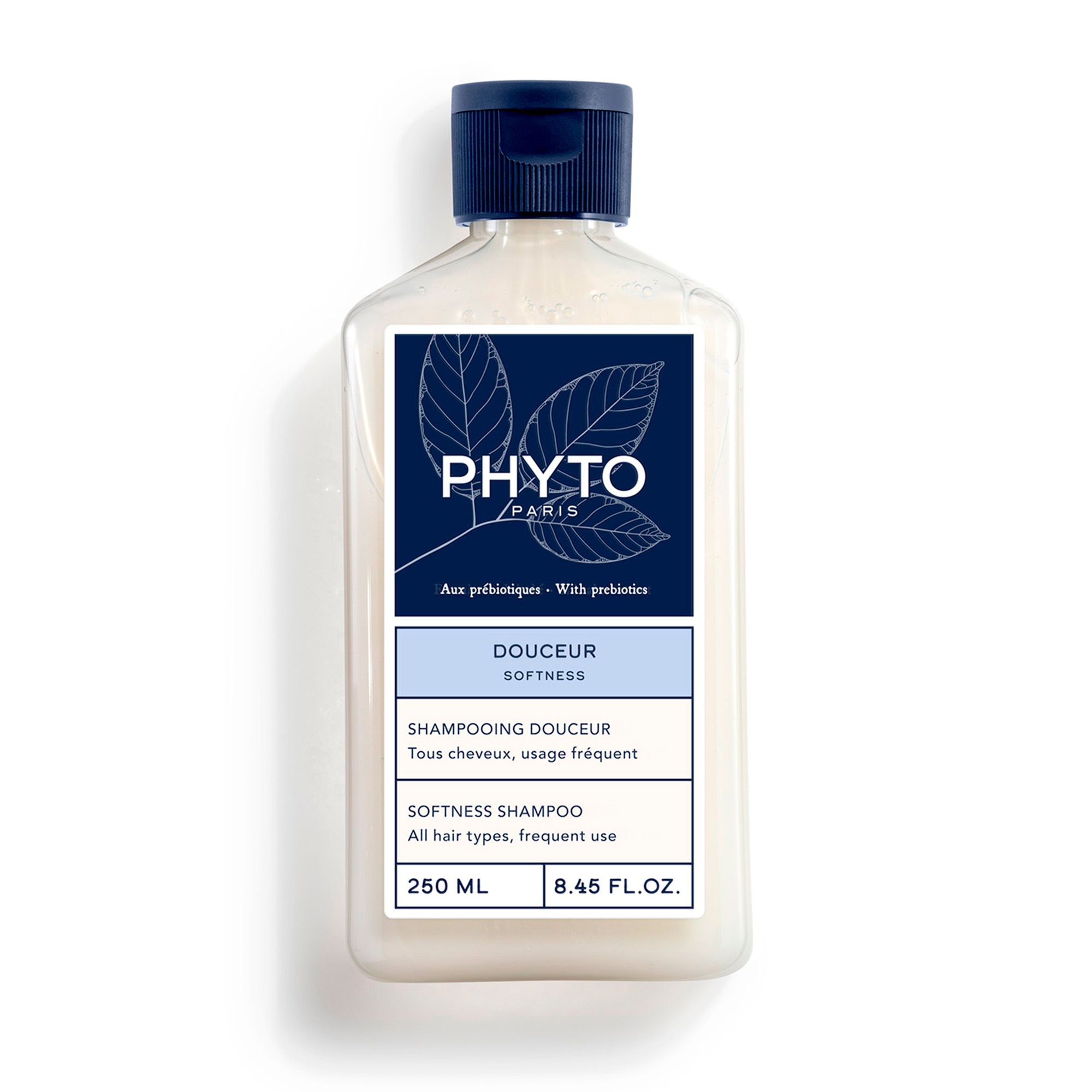 Shampoo fles, blauw-wit etiket. Opschrift: PHYTO PARIS, Douceur, Softness, 250 ml, 8.45 FL.OZ.