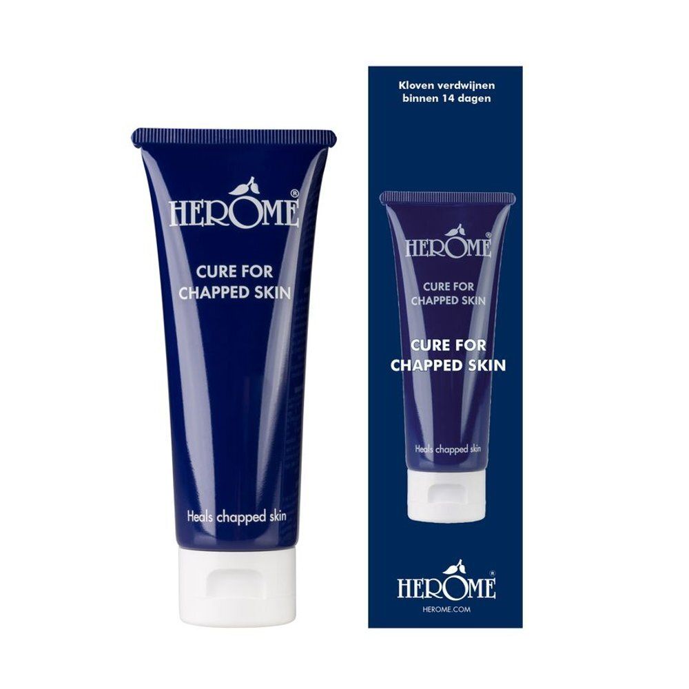 Tube bleu foncé avec bouchon blanc. Inscription: Herome Cure for Chapped Skin. Emballage avec image du produit et texte.