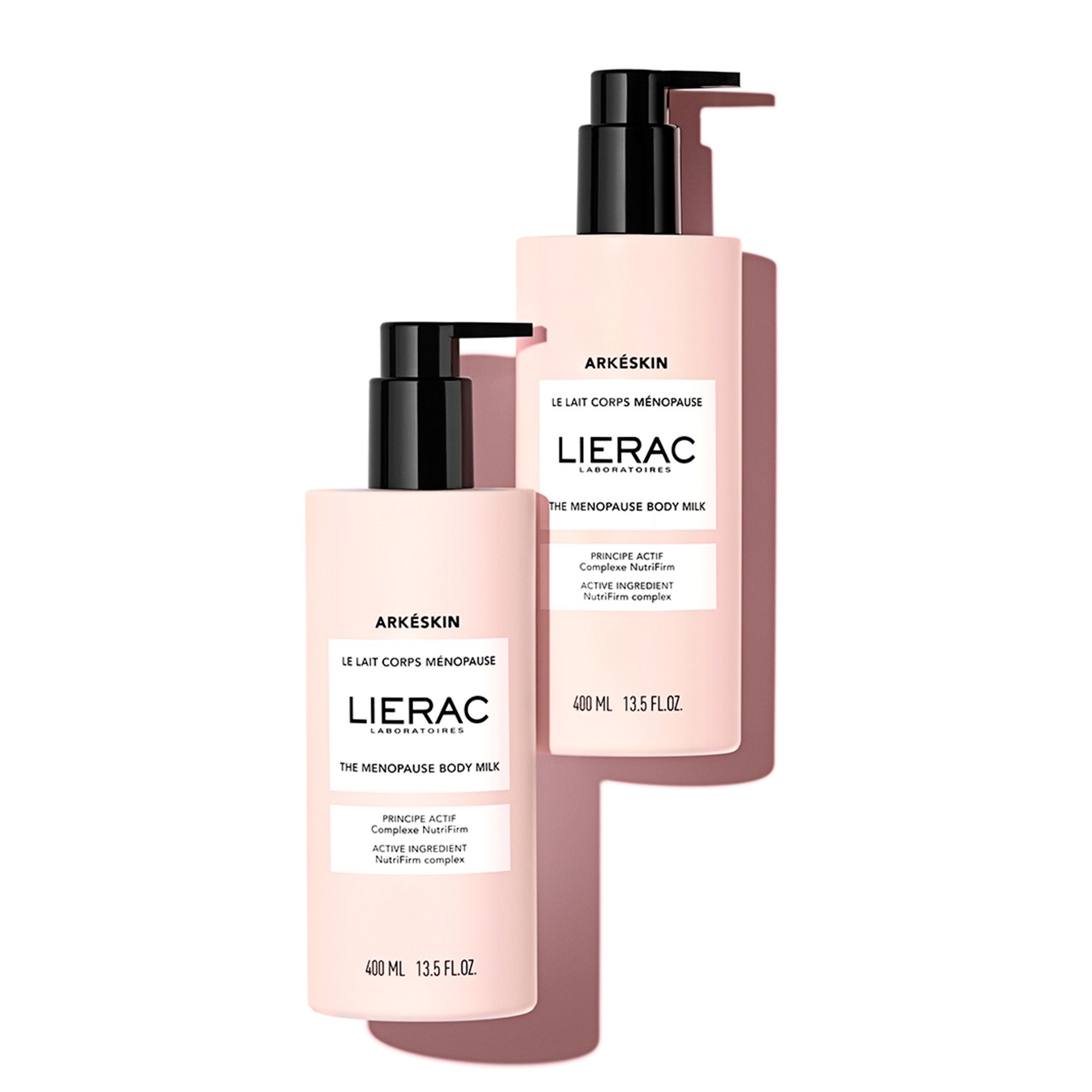 Twee roze flessen met zwarte pomp. Opschrift: Arkéskin, Le Lait Corps Ménopause, Lierac.