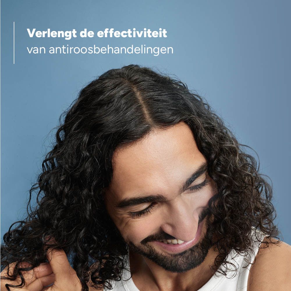 Ducray Kelual Elution fles. Tekst: Aanvullende verzorging voor een hoofdhuid die gevoelig is voor roos.
