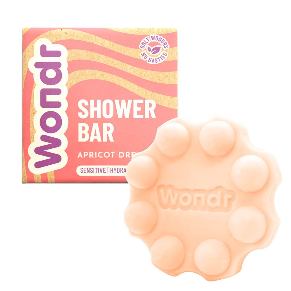Wondr Shower Bar en zeep. Roze verpakking en ronde zeep. Opschrift: Shower Bar, Apricot Dreams.