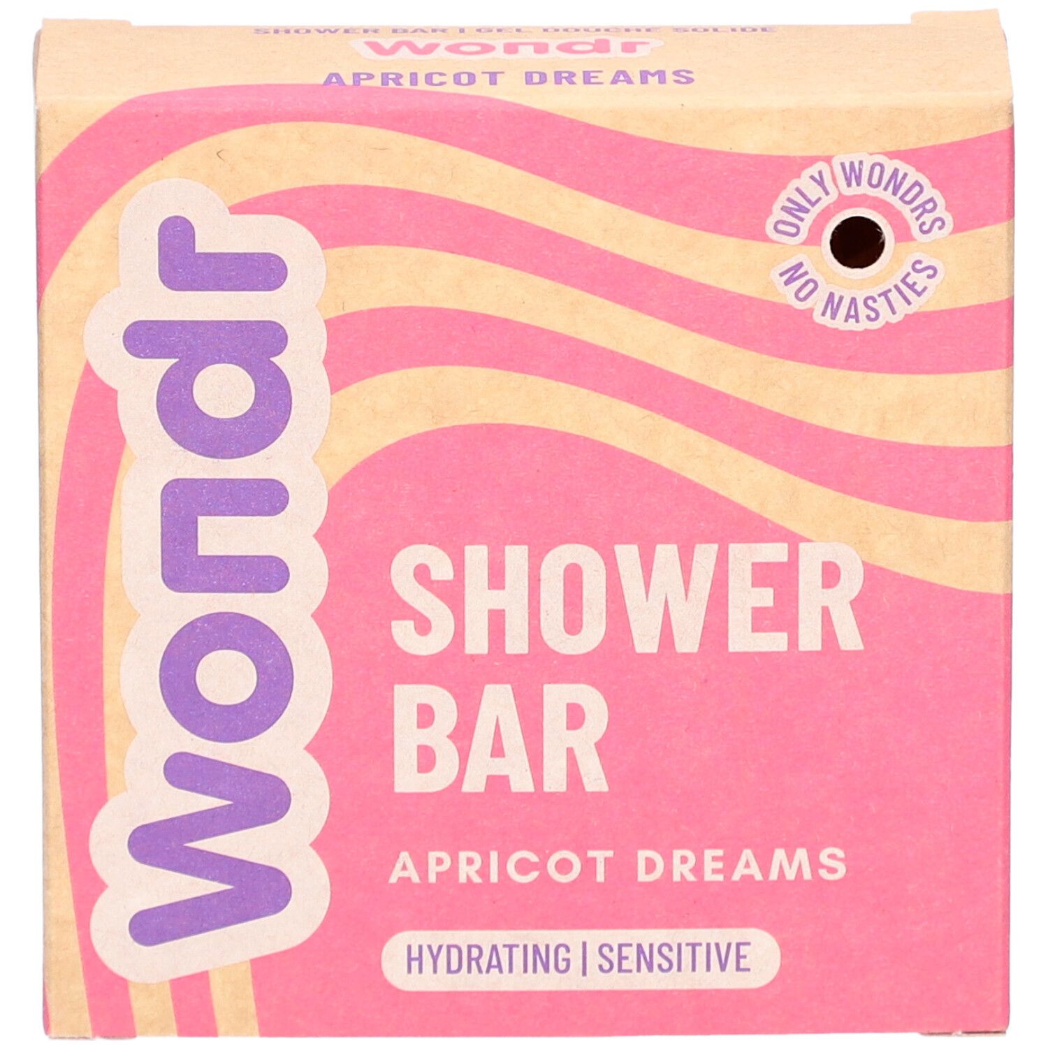 Barre de douche Wondr Apricot Dreams. Emballage rose à motifs ondulés. Inscription : Shower Bar, Hydratant, Sensible.
