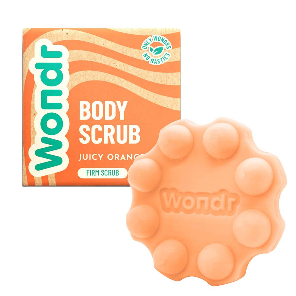 Wondr Body Scrub Juicy Orange en product. Oranje zeep met verpakking. Ronde vorm.