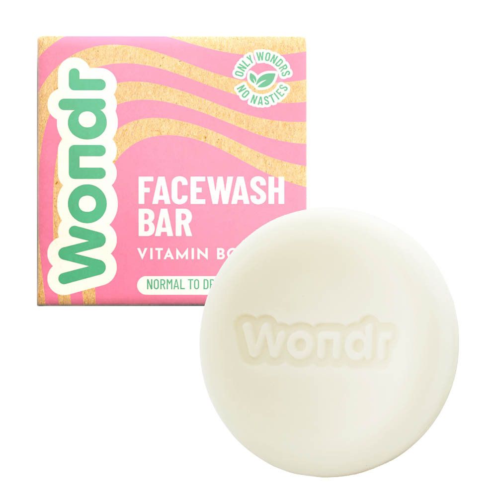 Wondr Facewash Bar en verpakking. Ronde zeep en roze-beige doos met logo en tekst.